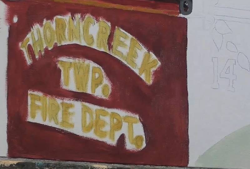 painting the door of the rusty car